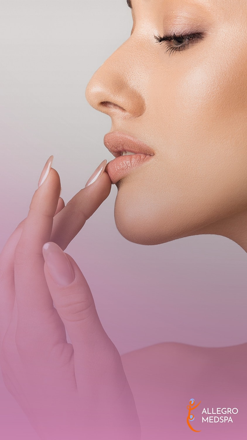 Close-up of a woman's face and hand.